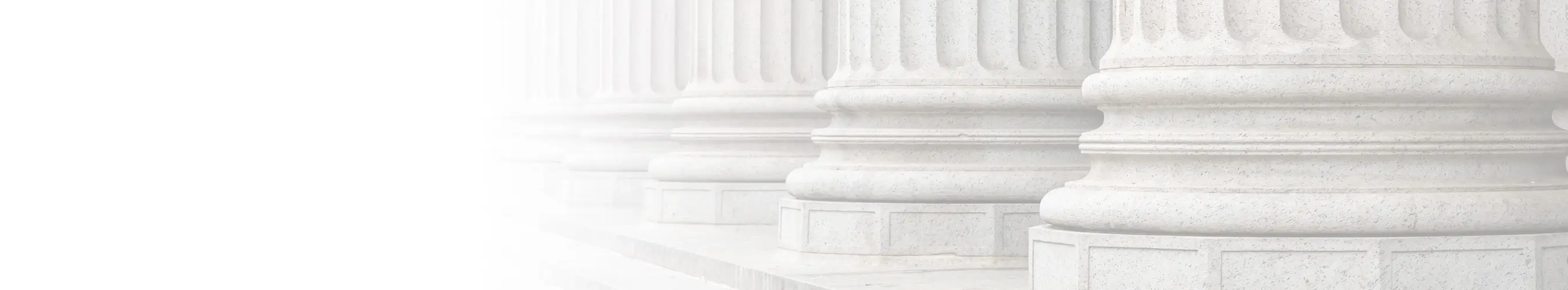 Close-up view of stone pillars of a courthouse